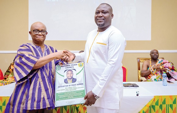 Dr Archibald Yao Letsa (left), Volta Regional Minister, presenting the citation to Clemence Gyato, the National Peace Ambassador Dr Archibald Yao Letsa (left), Volta Regional Minister, presenting the citation to Clemence Gyato, the National Peace Ambassador