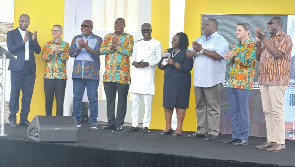 Samuel Amegayibor (3rd from right), Executive Secretary of GREDA, and some dignitaries applauding at the launch of the new housing project. INSET:  Some buildings constructed by Lakeside Estate  