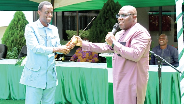 Seth Kwame Acheampong (right), Eastern Regional Minister, handing over the host baton  to Kwabena Okyere Darko-Mensah, Western Regional Minister. Picture: ERNEST KODZI