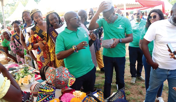 Mark Okraku-Mantey (right), Deputy Minister of Tourism, Arts and Culture, trying on one of the products made by the youth of Ada during the World Tourism Day Celebration. With him is Akwasi Agyeman (2nd from right), CEO, Ghana Tourism Authority. Picture: ELVIS NII NOI DOWUONA Mark Okraku-Mantey (right), Deputy Minister of Tourism, Arts and Culture, trying on one of the products made by the youth of Ada during the World Tourism Day Celebration. With him is Akwasi Agyeman (2nd from right), CEO, Ghana Tourism Authority. Picture: ELVIS NII NOI DOWUONA