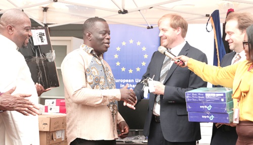 Wilhelm Hugo (2nd from right), GIZ, presenting the support equipment to Ignatius Baffour Awuah (2nd from left), Minister of Employment and Labour Relations, at the event. With them are Andreas Berding (right), Head of the Ghanaian-European Centre for Jobs, Migration and Development, and Alhaji Ibrahim Duada (left), Chief Labour Officer, Employment and Labour Ministry. Picture: EDNA SALVO-KOTEY