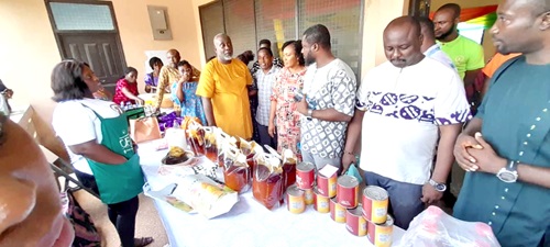 Remond Nana Damptey (arrowed), District Chief Executive, for Birim North, and his entourage inspecting the items being displayed