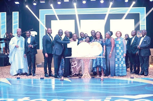 Akosua Frema Osei-Opare (arrowed), Chief of Staff, being supported by some dignitaries to cut the anniversary cake at the event Akosua Frema Osei-Opare (arrowed), Chief of Staff, being supported by some dignitaries to cut the anniversary cake at the event