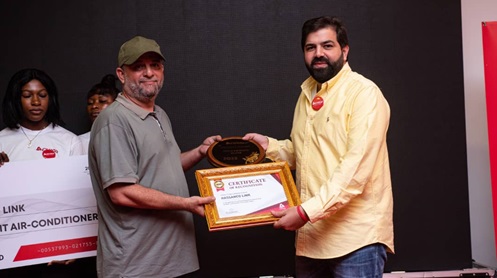 The Founder of Hassanco Link, Mr Mohammed T. Faili  recieving a certificate of recognition from the Husein Jabar, Managing Director of Inamar Company Limited