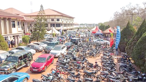 Vehicles and motorbikes parked at the venue of the event 