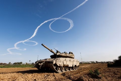 A tank stands near the border with the central Gaza, as the conflict continues between Israel and the Palestinian Islamist group Hamas, Israel January 22, 2024. REUTERS Israeli soldiers