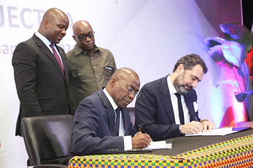 Elenos Karaindros (right), Chief Strategy and M & A, Mytilineos Energy and Metals, and Michael Ansah (left), CEO, Ghana Integrated Aluminium Development Corporation (GIADEC), signing the MoU in Accra. With them are Samuel Abu Jinapor (left) and Dr Oteng Gyasi (standing right), Board Chairman, GIADEC. Picture: SAMUEL TEI ADANO Elenos Karaindros (right), Chief Strategy and M & A, Mytilineos Energy and Metals, and Michael Ansah (left), CEO, Ghana Integrated Aluminium Development Corporation (GIADEC), signing the MoU in Accra. With them are Samuel Abu Jinapor (left) and Dr Oteng Gyasi (standing right), Board Chairman, GIADEC. Picture: SAMUEL TEI ADANO