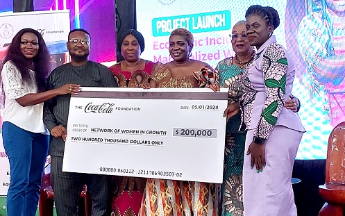 Mawulawoe Awity (right), Executive Director of NEWIG, Joyce R. Aryee (2nd from right), Executive Director of Salt and Light Ministries, and David Appiah (2nd from left), Senior Manager, Communications of the Coca-Cola Foundation, displaying a dummy cheque from the Coca-Cola Foundation Mawulawoe Awity (right), Executive Director of NEWIG, Joyce R. Aryee (2nd from right), Executive Director of Salt and Light Ministries, and David Appiah (2nd from left), Senior Manager, Communications of the Coca-Cola Foundation, displaying a dummy cheque from the Coca-Cola Foundation