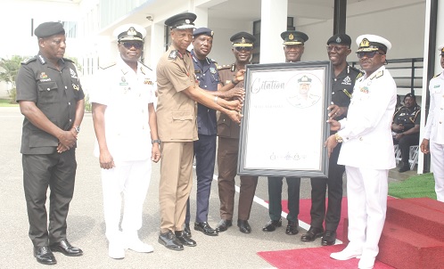 The heads of security agencies presenting a citation to Vice Admiral Seth Amoama (right) The heads of security agencies presenting a citation to Vice Admiral Seth Amoama (right)