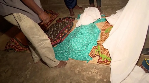 Dead bodies covered with clothes lie on the ground following a ferry accident in Nampula Province, Mozambique. Television of Mozambique/Reuters