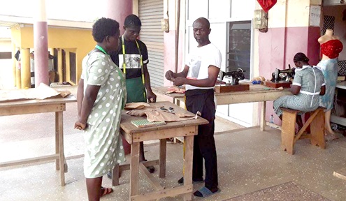 One of the teachers taking the apprentices through a lesson