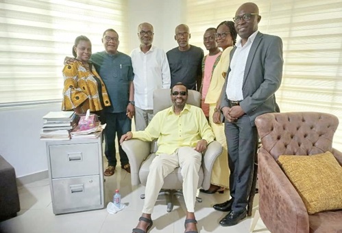 Cameron Duodo (seated) with some members of the anniversary committee