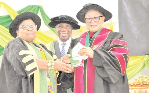 Professor Lydia Aziato (left), Vice Chancellor of UHAS, presenting the citation to Rev Dr Joyce Aryee, Executive Director of Salt and Light Ministries, with the citation, while Justice Jones Dotse, Chairman of UHAS, looks on with a smile Professor Lydia Aziato (left), Vice Chancellor of UHAS, presenting the citation to Rev Dr Joyce Aryee, Executive Director of Salt and Light Ministries, with the citation, while Justice Jones Dotse, Chairman of UHAS, looks on with a smile