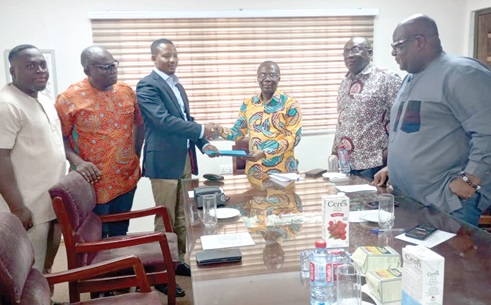 Henry Kwadwo Boateng (3rd from right), President, Institution of Engineering Technology-Ghana, exchanging a document with Awal Sakib Mohammed, President, Ghana Electrical Contractors Association. Looking on are members of both organisations Henry Kwadwo Boateng (3rd from right), President, Institution of Engineering Technology-Ghana, exchanging a document with Awal Sakib Mohammed, President, Ghana Electrical Contractors Association. Looking on are members of both organisations