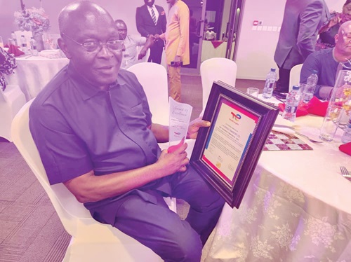  Joseph Kwaku Horgle displaying the award