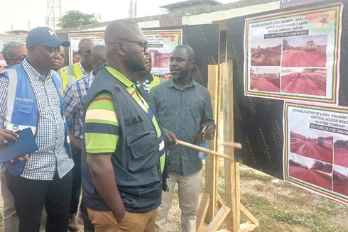 Mark Okyere (right), Ashanti Regional Director of Urban Roads, taking Francis Asenso-Boakye (2nd from left), Minister of Roads and Highways, through the project scope of the Ejisu-Abankro road