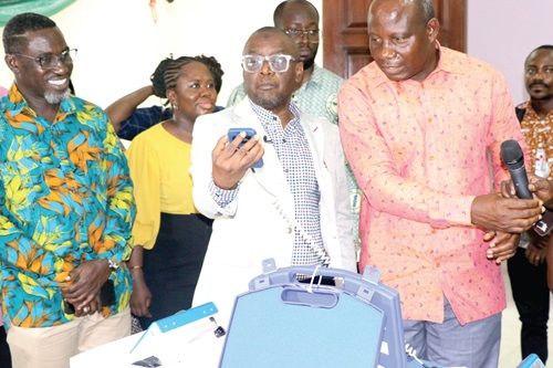 Alhaji Hafiz Adam (2nd from right), Chief Director, Ministry of Health, examining one of the equipment at the Calibration Centre in Accra. On his left is Kwame Sarfo, Deputy Director of Infrastructure, Ministry of Health Alhaji Hafiz Adam (2nd from right), Chief Director, Ministry of Health, examining one of the equipment at the Calibration Centre in Accra. On his left is Kwame Sarfo, Deputy Director of Infrastructure, Ministry of Health