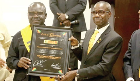 Kwaku Ofori Asiamah (left), Minister of Transport, being presented with a plaque by Col. Emmnauel Darquah (retd), a member of the Governing Council of CISCM Kwaku Ofori Asiamah (left), Minister of Transport, being presented with a plaque by Col. Emmnauel Darquah (retd), a member of the Governing Council of CISCM