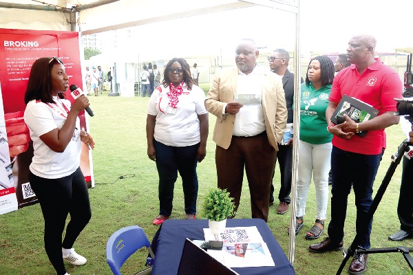 Angela Laryea (left), Business Development Officer, Broll Ghana Ltd, explaining a point to Ato Afful (right), Managing Director, GCGL, and Samuel Amegayibor (3rd from left), Executive Secretary, Ghana Real Estate Developers Association, during the Graphic-GREDA Housing Fair. Picture: ELVIS NII NOI DOWUONA Angela Laryea (left), Business Development Officer, Broll Ghana Ltd, explaining a point to Ato Afful (right), Managing Director, GCGL, and Samuel Amegayibor (3rd from left), Executive Secretary, Ghana Real Estate Developers Association, during the Graphic-GREDA Housing Fair. Picture: ELVIS NII NOI DOWUONA