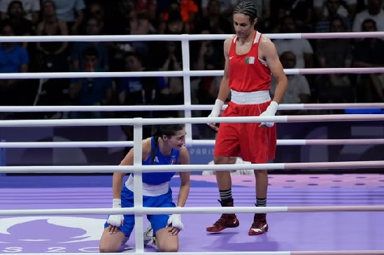 Imane Khelif, right, stands over Angela Carini (John Locher/AP) (AP) Imane Khelif, right, stands over Angela Carini (John Locher/AP) (AP)