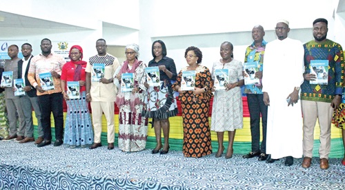 Dakoa Newman (6th from right), Minister for Gender, Children and Social Protection; Dr Comfort Asare (5th from right), National Director, Department of Social Welfare; Goukoue Rekia (6th from left), Counsellor, Niger Embassy; Wilfred Haruna (5th from left), Head of Operations, Catholic Relief Services, and other officials of the ministry displaying the strategic plan after the launch. Picture: ERNEST KODZI Dakoa Newman (6th from right), Minister for Gender, Children and Social Protection; Dr Comfort Asare (5th from right), National Director, Department of Social Welfare; Goukoue Rekia (6th from left), Counsellor, Niger Embassy; Wilfred Haruna (5th from left), Head of Operations, Catholic Relief Services, and other officials of the ministry displaying the strategic plan after the launch. Picture: ERNEST KODZI