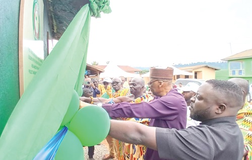 Baba Gana Wakil (right), Resident Representative of ECOWAS in Ghana, cutting the tape to officially inaugurate the new water facility at Odumase-Begoro Baba Gana Wakil (right), Resident Representative of ECOWAS in Ghana, cutting the tape to officially inaugurate the new water facility at Odumase-Begoro