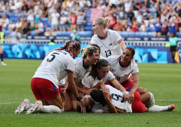 Team USA celebrating their achievement Team USA celebrating their achievement