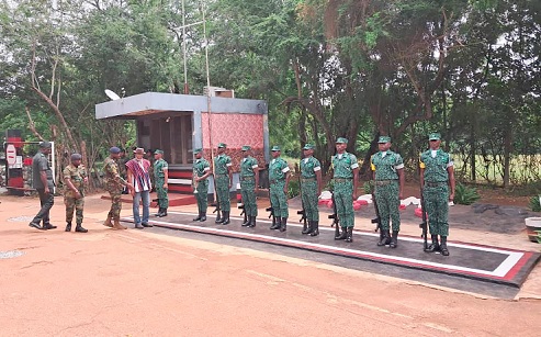Musah Superior (in smock),  Deputy Chief Executive Officer of the Forestry Commission, inspecting the guard of honour
