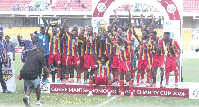 Players and officials of Hearts of Oak celebrating with the Gbese Mantse Homowo Peace Charity Cup after their shootout victory over Kpando Heart of Lions. Pictures: ERNEST KODZI Players and officials of Hearts of Oak celebrating with the Gbese Mantse Homowo Peace Charity Cup after their shootout victory over Kpando Heart of Lions. Pictures: ERNEST KODZI