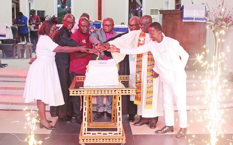 Rev. Dr Godwin Nii Noi Odonkor (middle), Clerk of the General Assembly, Presbyterian Church of Ghana, cutting the anniversary cake. Assisting him are Dr K. B. Darkwah (3rd from left), Anniversary planning committee chair, and other ministers of the Presbyterian Church. Picture: ERNEST KODZI