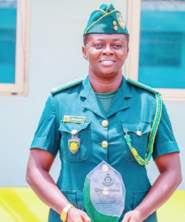 Deputy Superintendent of Immigration Anita Wiredu-Mintah, the head of  the Sports Directorate of the Ghana Immigration Service, earns promotion to Superintendent
