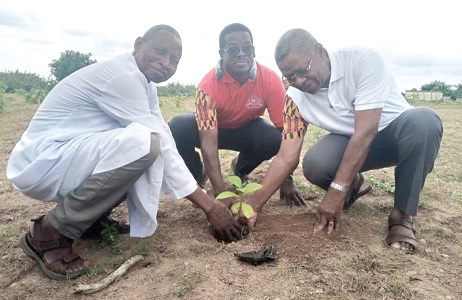 Sir Knight Brother Richard Ayih-Akakpo (right), President of MAREDES; Worthy Brother Maurice Adu-Amankwah (middle), Supreme Secretary of the Knights and Marshall; being supported by Rev. Fr James Yamba, the Chaplain and Chairman of the tree planting committee, to plant a tree Sir Knight Brother Richard Ayih-Akakpo (right), President of MAREDES; Worthy Brother Maurice Adu-Amankwah (middle), Supreme Secretary of the Knights and Marshall; being supported by Rev. Fr James Yamba, the Chaplain and Chairman of the tree planting committee, to plant a tree
