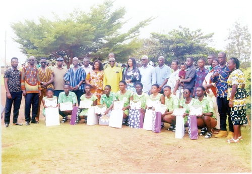 Sampson Adjei (7th from right standing) with staff and some old students as well as the beneficiaries (squatting) after the presentation Sampson Adjei (7th from right standing) with staff and some old students as well as the beneficiaries (squatting) after the presentationSampson Adjei (7th from right standing) with staff and some old students as well as the beneficiaries (squatting) after the presentation