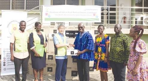 Namun Heo (3rd from left), Country Director, Good Neighbors Ghana, presenting the condoms to Dr Anthony Ofosu (4th from right), Deputy Director-General, Ghana Health Service. With them are officials of the GHS and Good Neighbors Ghana. Picture: EDNA SALVO-KOTEY Namun Heo (3rd from left), Country Director, Good Neighbors Ghana, presenting the condoms to Dr Anthony Ofosu (4th from right), Deputy Director-General, Ghana Health Service. With them are officials of the GHS and Good Neighbors Ghana. Picture: EDNA SALVO-KOTEY