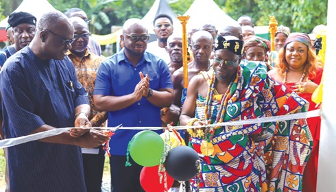 Kwaku Ampratwum-Sarpong (left), the Deputy Minister of Foreign Affairs and Regional Integration, being assisted by Togbe Atatsi V, the Chief of Leklebi Kame, to cut the sod to commission the project Kwaku Ampratwum-Sarpong (left), the Deputy Minister of Foreign Affairs and Regional Integration, being assisted by Togbe Atatsi V, the Chief of Leklebi Kame, to cut the sod to commission the project