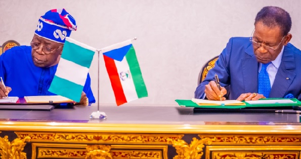 President Bola Tinubu (left) and Equatorial Guinean President Teodoro Mbasogo signing the the documents President Bola Tinubu (left) and Equatorial Guinean President Teodoro Mbasogo signing the the documents