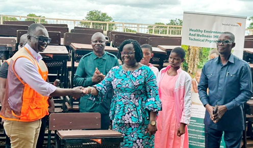 Francis Gumah (left), Northern Regional Operations Manager of World Vision Ghana, in a handshake with Vida Diorotey, DCE of Wa West, after the presentation. Behind the DCE is Peter Lanchene Toobu, the MP for Wa West Francis Gumah (left), Northern Regional Operations Manager of World Vision Ghana, in a handshake with Vida Diorotey, DCE of Wa West, after the presentation. Behind the DCE is Peter Lanchene Toobu, the MP for Wa West