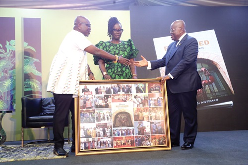 President Akufo-Addo (right) being presented with a gift by Akwasi Agyeman (left), Chief Executive Officer, Ghana Tourism Authority, during the launch of When We Returned: From Chains to Crowns in Accra. Picture: SAMUEL TEI ADANO President Akufo-Addo (right) being presented with a gift by Akwasi Agyeman (left), Chief Executive Officer, Ghana Tourism Authority, during the launch of When We Returned: From Chains to Crowns in Accra. Picture: SAMUEL TEI ADANO