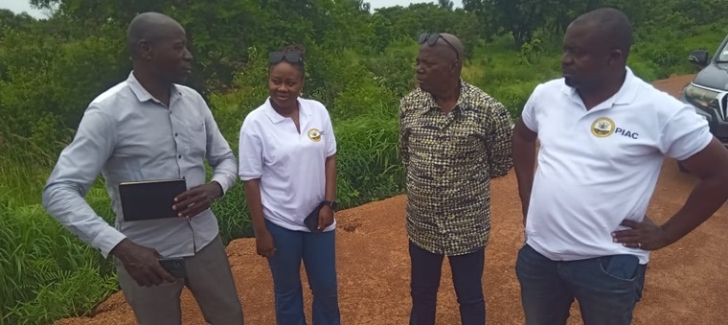  The current state of a section of the Bolgatanga-Naaga road. INSET: Henry Atindana (left) Bolgatanga Municipal Urban Roads Engineer, briefing Nana Kweku Dei (2nd from right) and other members of PIAC on the Bolgatanga-Naaga road project.