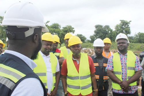 Nana kweku Dei (2nd from right), leader of the PIAC team, receiving briefing on the Garu hospital project Nana kweku Dei (2nd from right), leader of the PIAC team, receiving briefing on the Garu hospital project