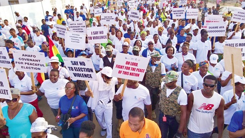  Emmanuel Ketaman Evortepe (arrowed), Executive President of the Duamenefa Foundation and Chief Executive Officer of Fafaa 100.3 FM, leading the peace walk in Denu last Saturday 