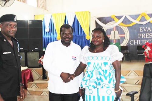 Mustapha Tassah, the NPP parliamentary candidate, and Mary Yawa Aforla,  the LPG parliamentary candidate, in a handshake during the ceremony