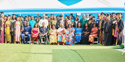 Dignitaries and some graduates after the ceremony