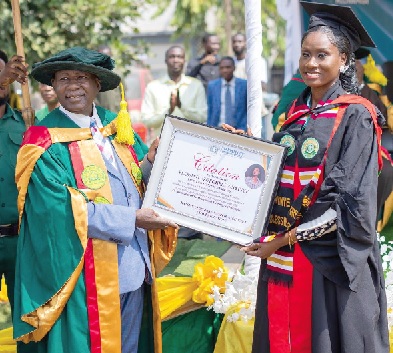 Albert Acquah, Founder of GCUC, presenting a certificate to Miss Blessing Uzoeghelu Onyine for emerging as the overall best student of School of Health and Allied Sciences