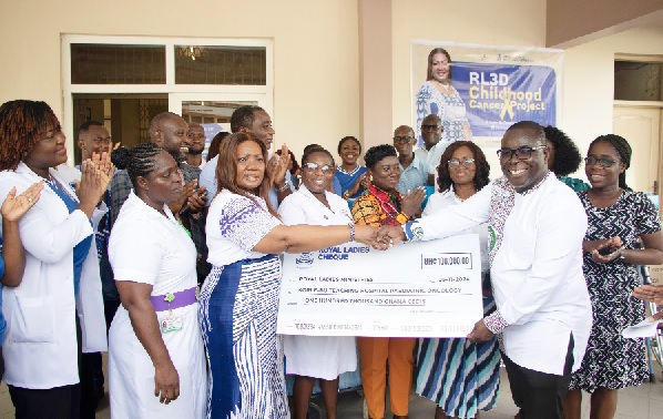 Rev. Mrs Rita Korankye-Ankrah (3rd from left), Founder and President of Royal Ladies Ministries International, presenting a cheque for GH¢100,000 to Dr Frank Owusu-Sekyere (2nd from right), acting Chief Executive Officer of the KBTH, during the ceremony. Looking on are some officials of KBTH, and members of the Royal Ladies Ministries International. Picture: EDNA SALVO KOTEY Rev. Mrs Rita Korankye-Ankrah (3rd from left), Founder and President of Royal Ladies Ministries International, presenting a cheque for GH¢100,000 to Dr Frank Owusu-Sekyere (2nd from right), acting Chief Executive Officer of the KBTH, during the ceremony. Looking on are some officials of KBTH, and members of the Royal Ladies Ministries International. Picture: EDNA SALVO KOTEY