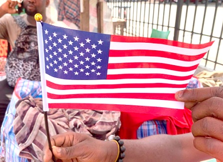Some flag merchants at Circle said alot of these congregants patronised the American flag Some flag merchants at Circle said alot of these congregants patronised the American flag