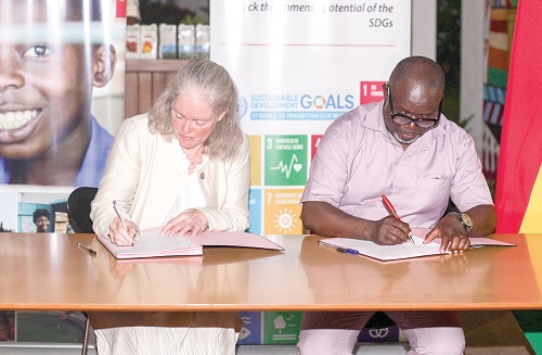 Marianne Thyrring (left), Director-General, Danish Meteorological Institute, signs for the institute, while Eric Asuman, acting Director-General, Ghana Meteorological Agency, appends his signature for the aggreement. Picture: Caleb Vanderpuye Marianne Thyrring (left), Director-General, Danish Meteorological Institute, signs for the institute, while Eric Asuman, acting Director-General, Ghana Meteorological Agency, appends his signature for the aggreement. Picture: Caleb Vanderpuye