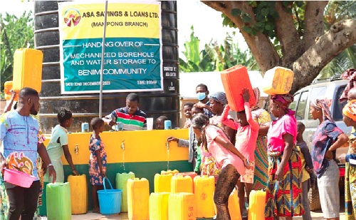 Some residents of Benim with their empty gallons fetching water from the newly commissioned borehole. Picture: EMMANUEL BAAH Some residents of Benim with their empty gallons fetching water from the newly commissioned borehole. Picture: EMMANUEL BAAH