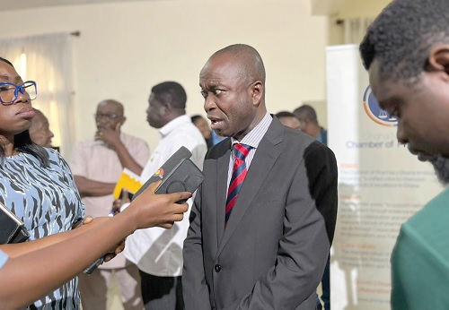 Dr William Adum Addo (right), President, Pharmaceutical Importers and Wholesalers Association, speaking to the media