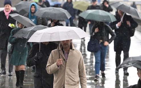 Workers cross London Bridge during the morning rush hour in London, Britain, March 10, 2023. REUTERS Britain recession